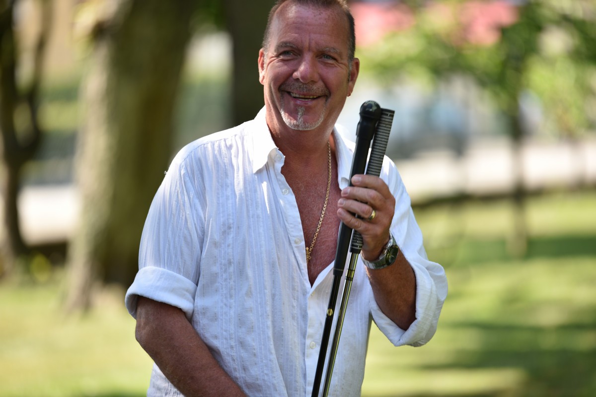 Older man smiling outdoors